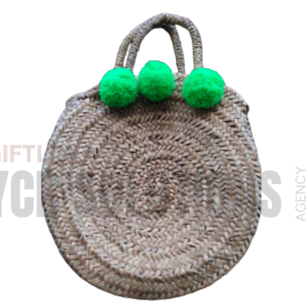 Sac rond en fibres naturelles avec pompons décoratifs